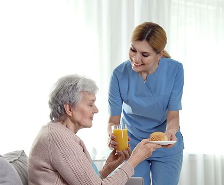nurse serving drink